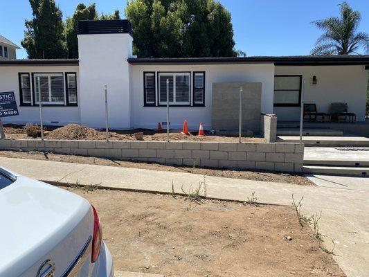 AFTER: Stucco fireplace with chimney cap.