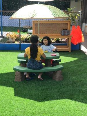 Our outdoor classroom gives children access to a wood working bench and a beautiful picnic table.