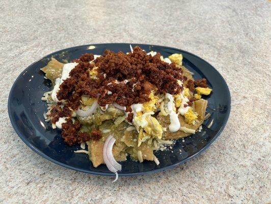 Green salsa chilaquiles with chorizo.