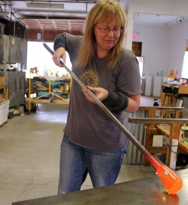 Linda Perrin blowing glass in the studios of Atlantic Art Glass. One can watch glass blowing in this location by calling ahead.