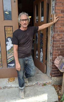 James in front of his studio.