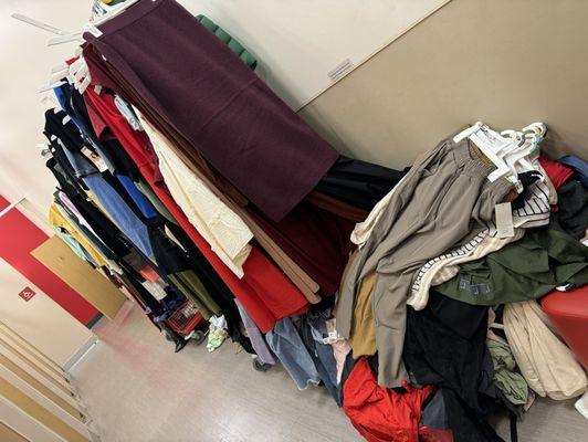 Piles and piles of clothes all over! Yes they're racks of clothes, but that pile of clothes in the picture is one of at least 15 of them!!!