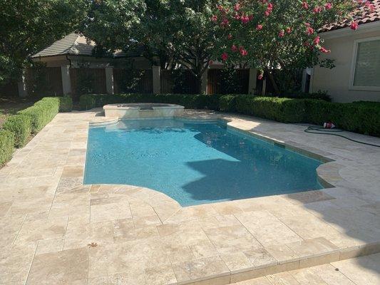 Travertine decking and pool coping.