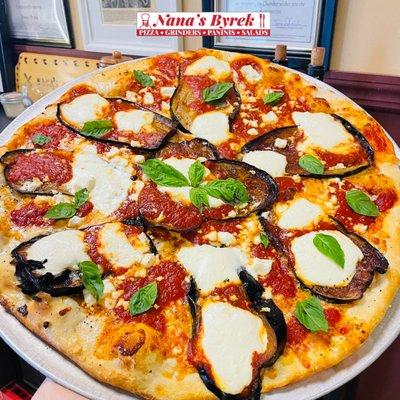 Eggplant , ricotta cheese.
 ,mozzarella cheese and basil pizza