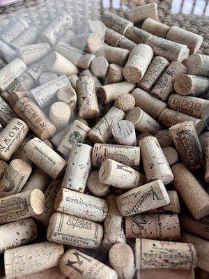 Corks inside the tables on the porch