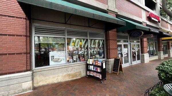 Front side of the store with interesting quotes on the sandwich board