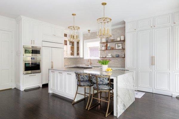 Custom cabinets with double waterfall island.