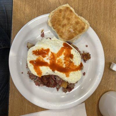 Hash, eggs and a generous measure of hot sauce.