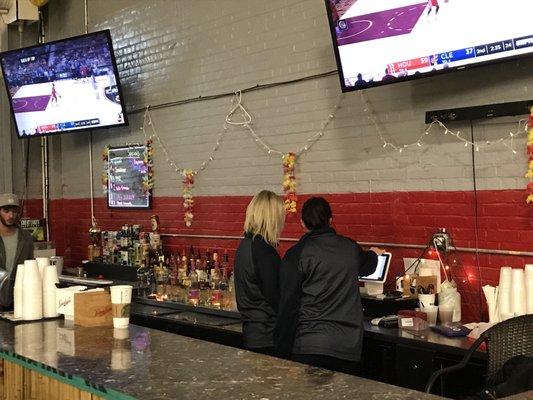 2 big screens at the bar.