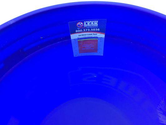 To Measure Evaporation. Bucket filled with pool water, set on the inside pool step, measurement sticker placed inside the bucket.