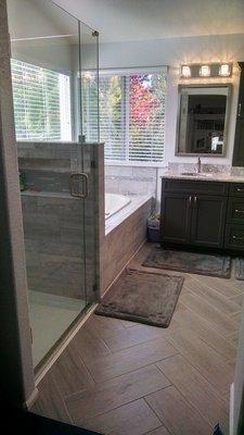 We love our new bathroom and the herringbone pattern David did for our tile.