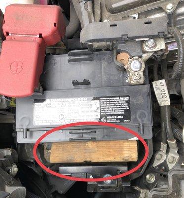 Wrong size battery with piece of wood