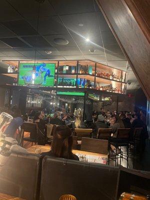 Bar area has a lot of tvs