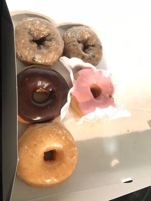 Assorted donuts: Blueberry, Strawberry, Chocolate and glaze. All delicious