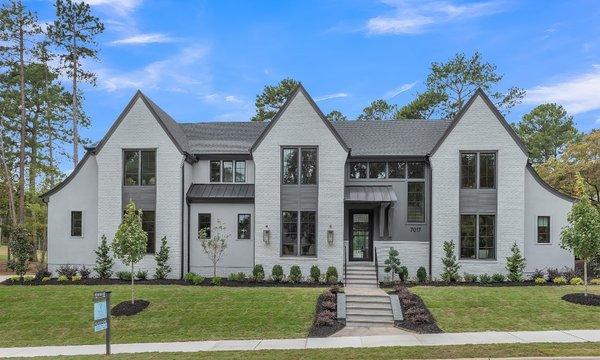 We installed all new oversized 6" seamless gutters and large 4" round downspouts and elbows on the whole house.