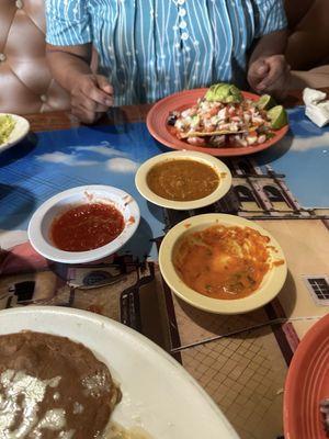 Chips dipping sauce and tostado de pulpo y camarones.