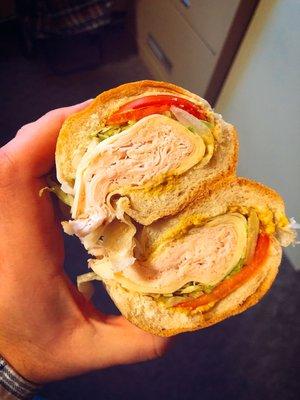 turkey and Swiss w/ lettuce, tomato, and mustard on a club roll