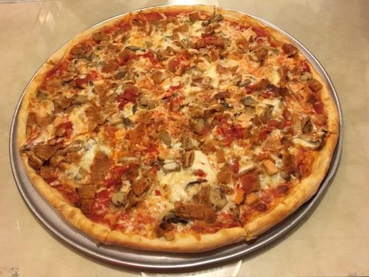 Large pizza pie with mushroom and chicken