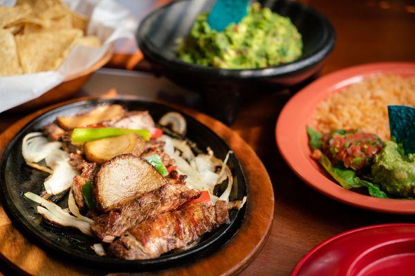 Delicious Fajitas, with rice, beans, guacame,and pico de gallo.