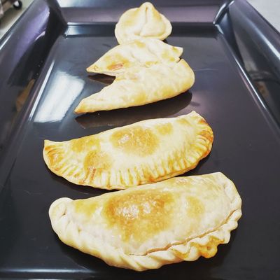 All of our empanadas from front to back: Bulgogi, Char Siu, Thai Chiki, Naka, and Queso.