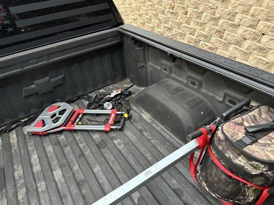 Photo of the truck bed with cover rails still on.