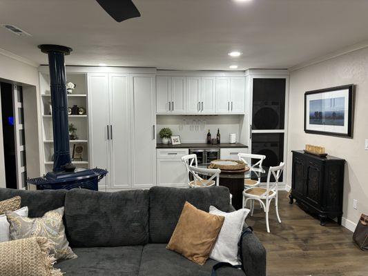 Final product:  Laundry room disguised as family room cabinets.