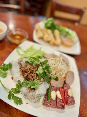 Bánh Cuon, steamed rice roll, stuffed with grounded pork & mushroom, fried shallot, fresh herbs, bean sprout, ham topping, and more