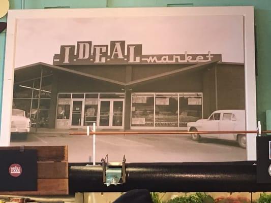 Historic poster of the original market, on the wall over the produce section.