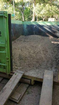 French drain and gravel patio dirt fit in this 10 cubic foot dumpster.