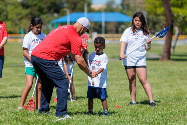 big and little learning the game of lacrosse