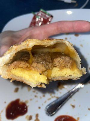 Sausage egg and cheese pastry puff inside