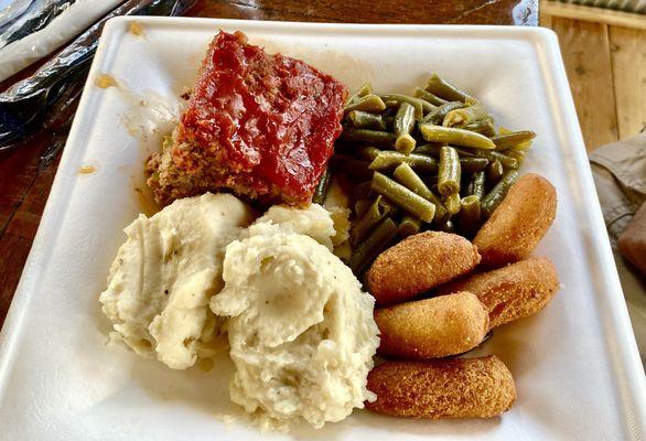 Meatloaf, mashed potatoes, green beans, hush puppies