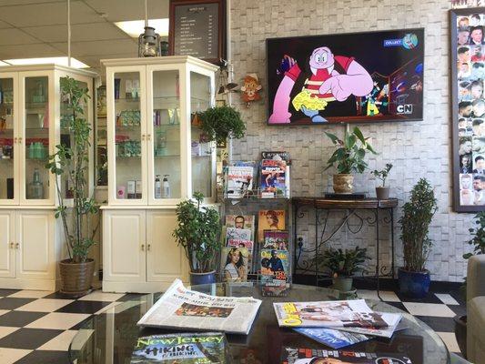 Interior of shop near door - a modest barber shop waiting area. (4/8/2017)