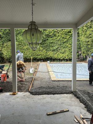 Installing concrete base.