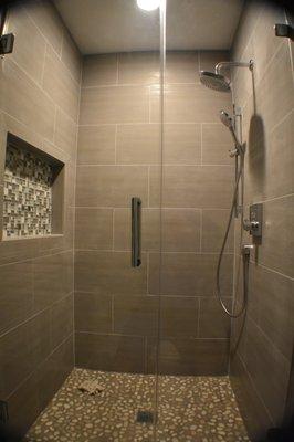 new shower with large soap box and glass door