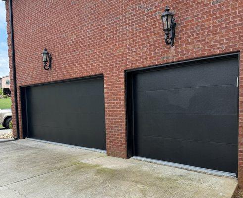 Black flushed panel garage door.