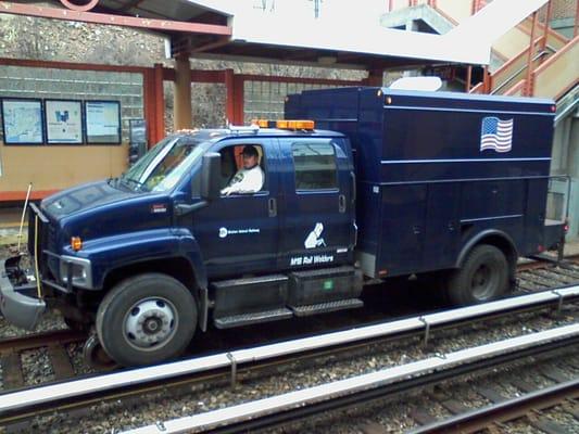 Notice the small metal wheels, similar to the ones on trains, behind the truck tires.