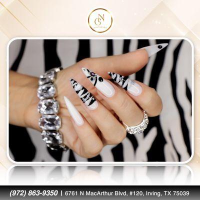 Striking a pose with this black and white mani! The perfect balance of bold and chic.