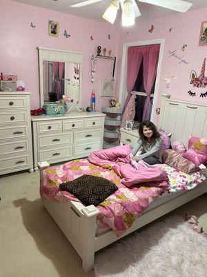 My daughter with her new bedroom set !! Thanks so much value city.  You made this princess so happy !