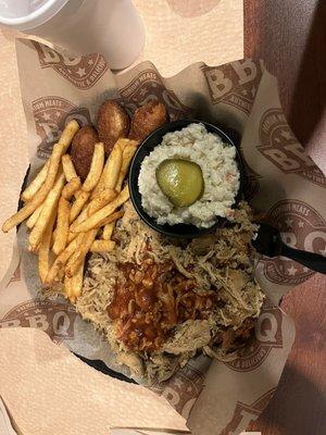 Barbecue, slaw, French fries, and Hush Puppies