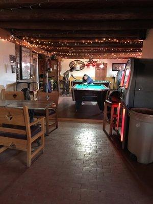 Pool tables in the back (quarter fed) and darts!