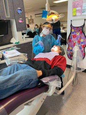 Dental Assistant performing Coronal Polish