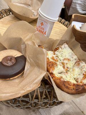 Cookie, cheese bread, and aqua panna water.