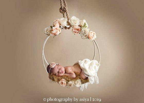 Newborn with flowers