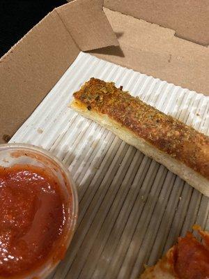 Red peppers on breadsticks.