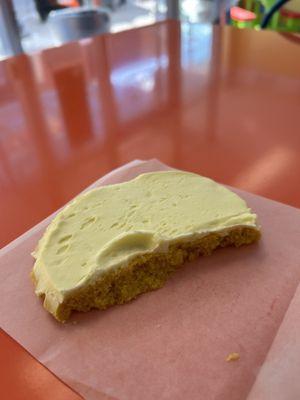 half eaten lemon cookie with frosting