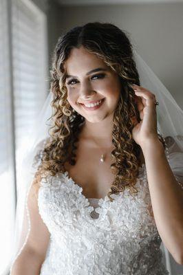 bridal half up half down on curly hair