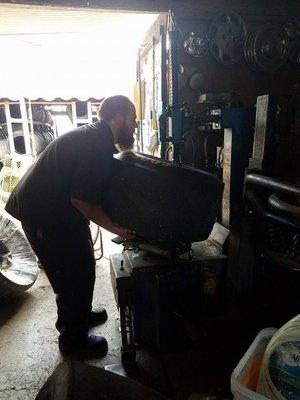 Big A at work; mounting rear racing tires.