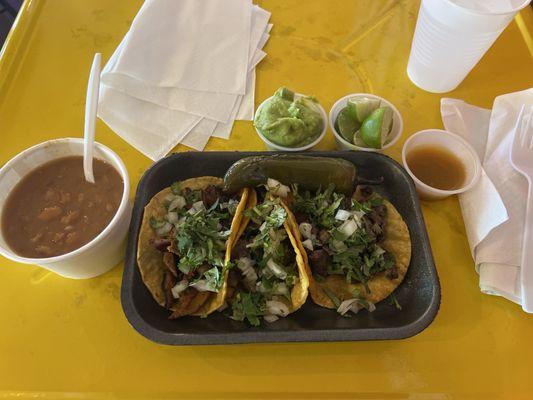 Beans, carne asada and al pastor. Love that they have grilled jalapeños and onion