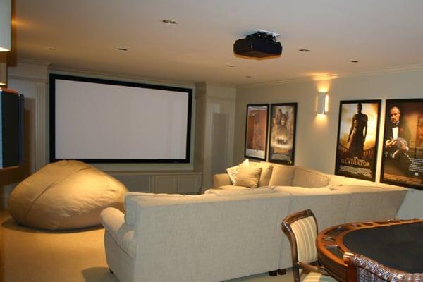 Custom built surround houses speakers and screen in this great multi-purpose room.